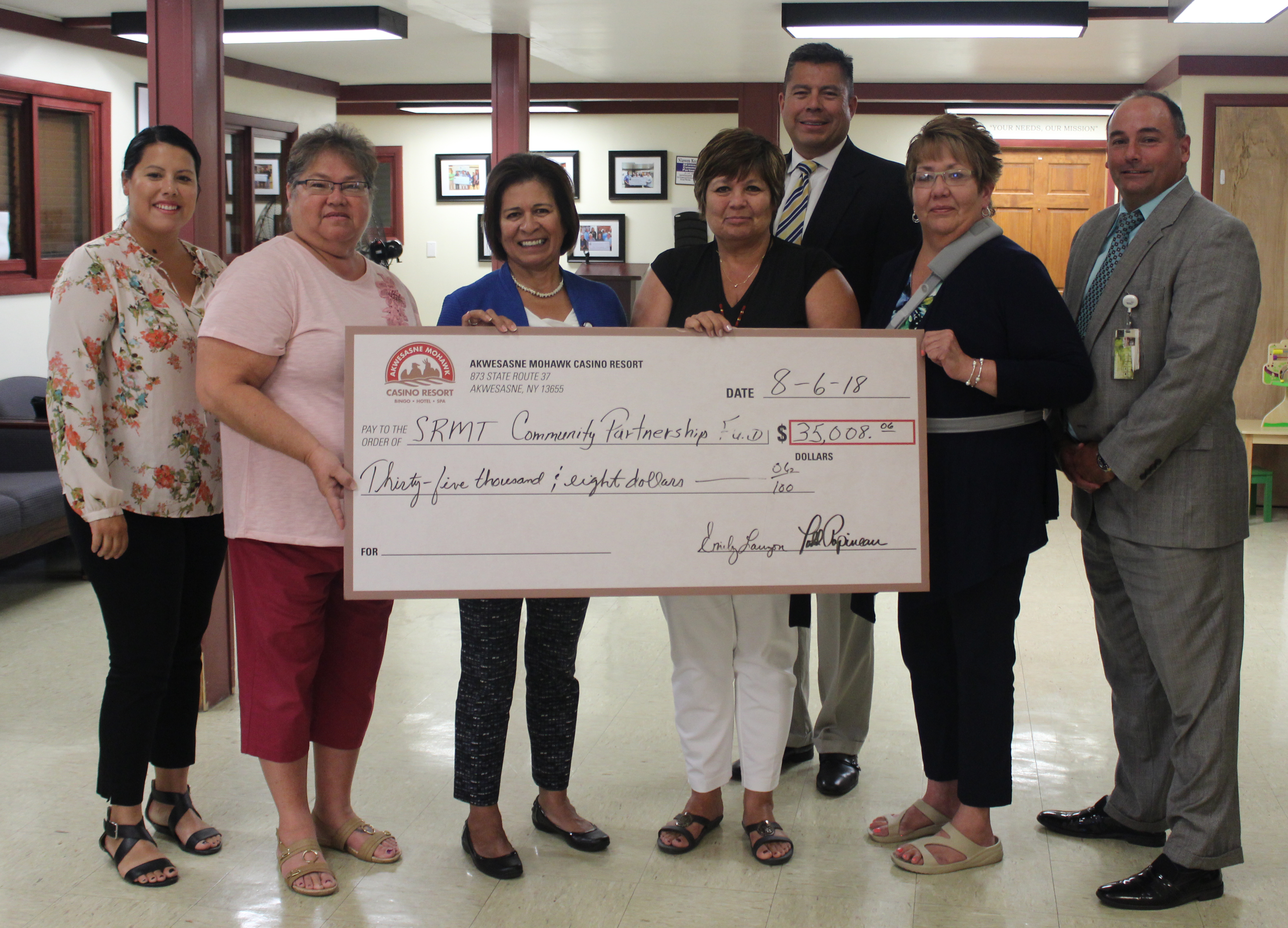 Baji999 Casino Resort deliver checks to recipients of their first annual golf fundraising event